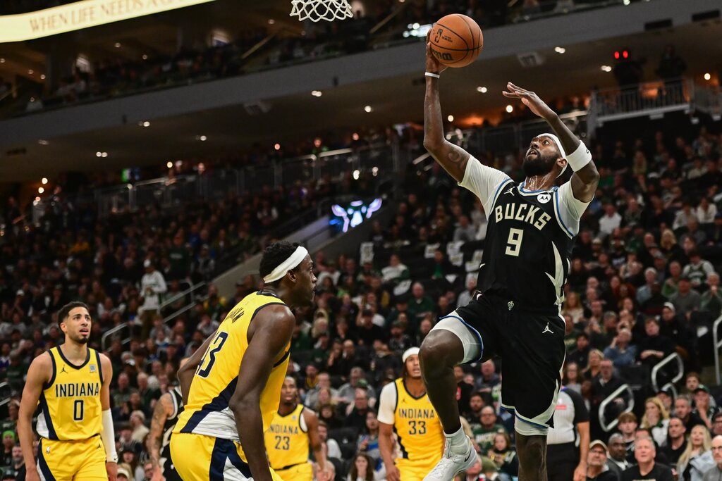Apr 27, 2025; Milwaukee, Wisconsin, USA; Milwaukee Bucks forward Bobby Portis (9) takes a shot against Indiana Pacers forward Pascal Siakam (43) in the third quarter during game four of first round for the 2024 NBA Playoffs at Fiserv Forum. Mandatory Credit: Benny Sieu-Imagn Images