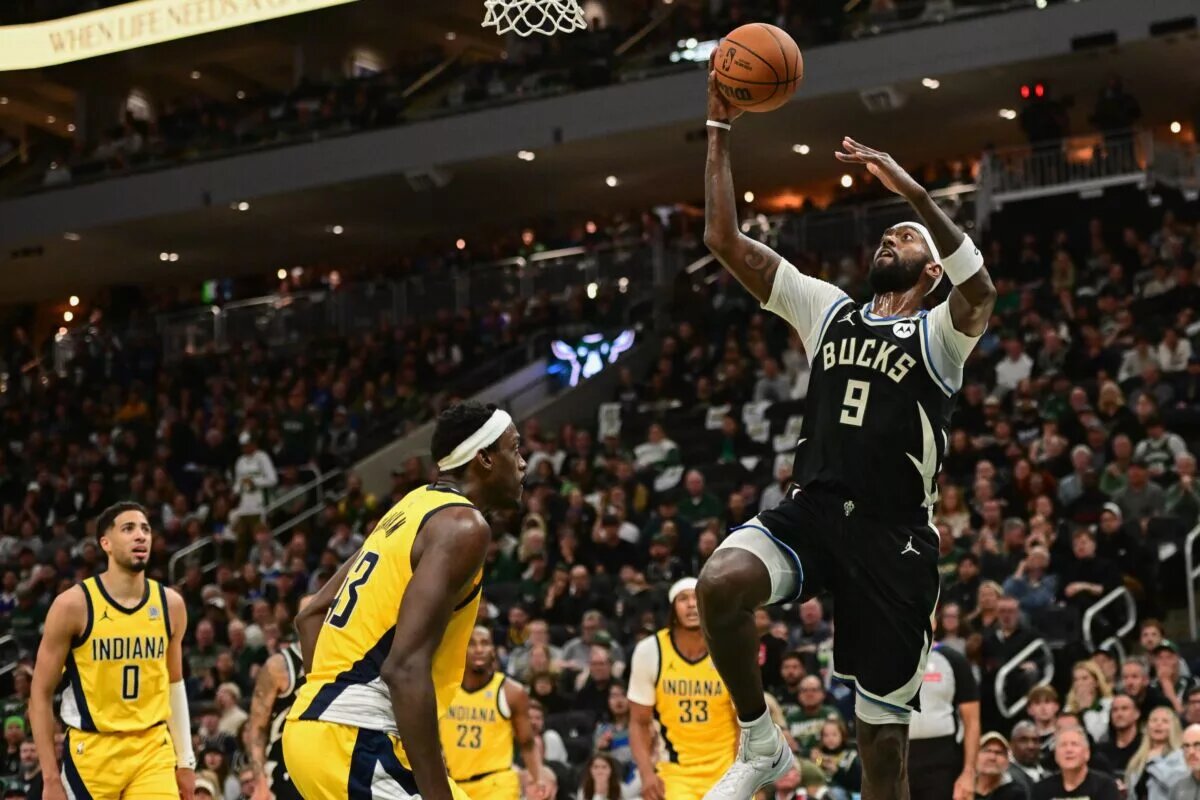Apr 27, 2025; Milwaukee, Wisconsin, USA; Milwaukee Bucks forward Bobby Portis (9) takes a shot against Indiana Pacers forward Pascal Siakam (43) in the third quarter during game four of first round for the 2024 NBA Playoffs at Fiserv Forum. Mandatory Credit: Benny Sieu-Imagn Images