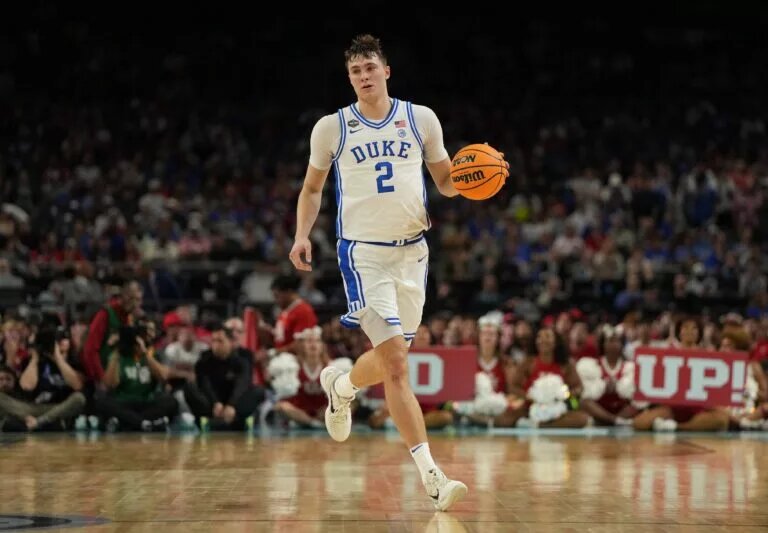 Duke freshman forward Cooper Flagg handles the ball up the court
