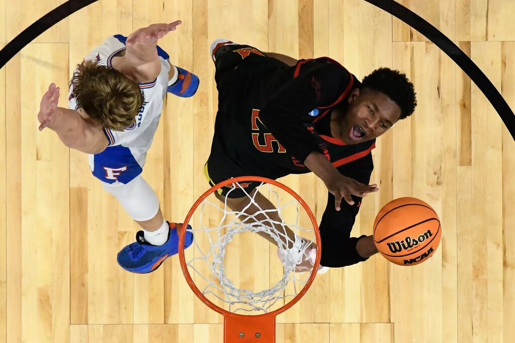 Maryland Terrapins center Derik Queen (25) attempts a basket against Florida Gators forward Thomas Haugh (10) in the second half during a West Regional semifinal of the 2025 NCAA tournament at Chase Center. 