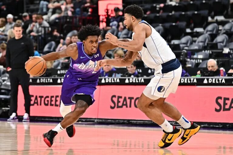 Utah Jazz guard Collin Sexton (2) drives around former Dallas Mavericks wing Quentin Grimes (5)