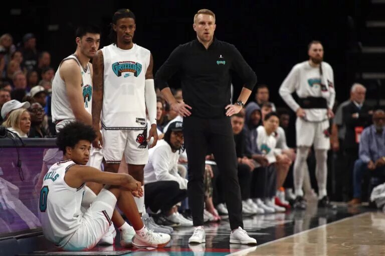 Memphis Grizzlies head coach Tuomas Iisalo, point guard Ja Morant, wing Jaylen Wells, and center Zach Edey