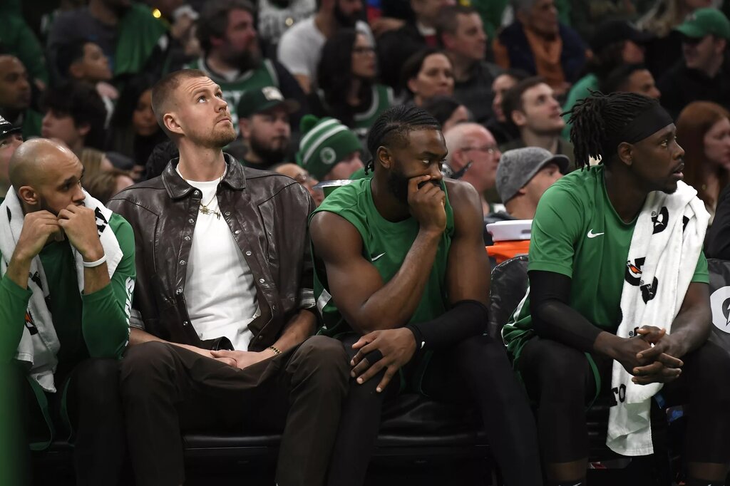 Boston Celtics center Kristaps Porzingis (8) guard Jaylen Brown (7) and guard Jrue Holiday 