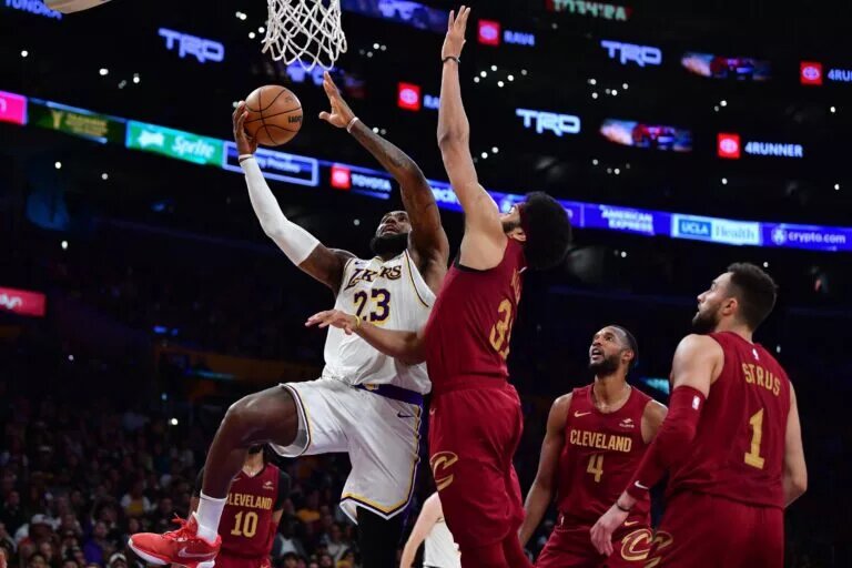 Apr 6, 2024; Los Angeles, California, USA; Los Angeles Lakers forward LeBron James (23) moves to the basket against Cleveland Cavaliers center Jarrett Allen (31) during the second half at Crypto.com Arena. Mandatory Credit: Gary A. Vasquez-USA TODAY Sports