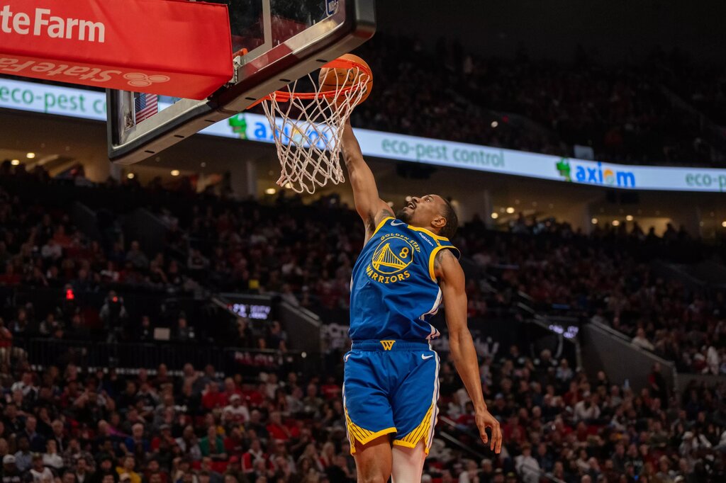 Oct 23, 2024; Portland, Oregon, USA; Golden State Warriors shooting guard De'Anthony Melton (8) dunks the ball during the second half against the Portland Trailblazers at Moda Center. Mandatory Credit: Stephen Brashear-Imagn Images