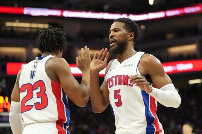 Dec 26, 2024; Sacramento, California, USA; Detroit Pistons guard Malik Beasley (5) high fives guard Jaden Ivey (23) after a play against the Sacramento Kings during the third quarter at Golden 1 Center. Mandatory Credit: Kelley L Cox-Imagn Images