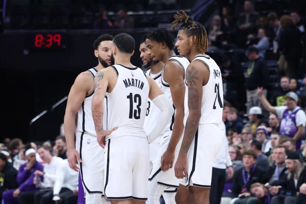 The Brooklyn Nets huddle before the start of overtime against the Utah Jazz at Delta Center.