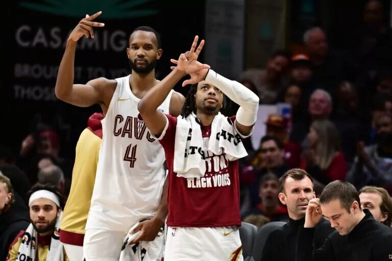 Cleveland Cavaliers forward Evan Mobley (4) and guard Darius Garland (10) celebrate after guard Sam Merrill (not pictured) hit a three point basket during the second half against the Dallas Mavericks at Rocket Mortgage FieldHouse.