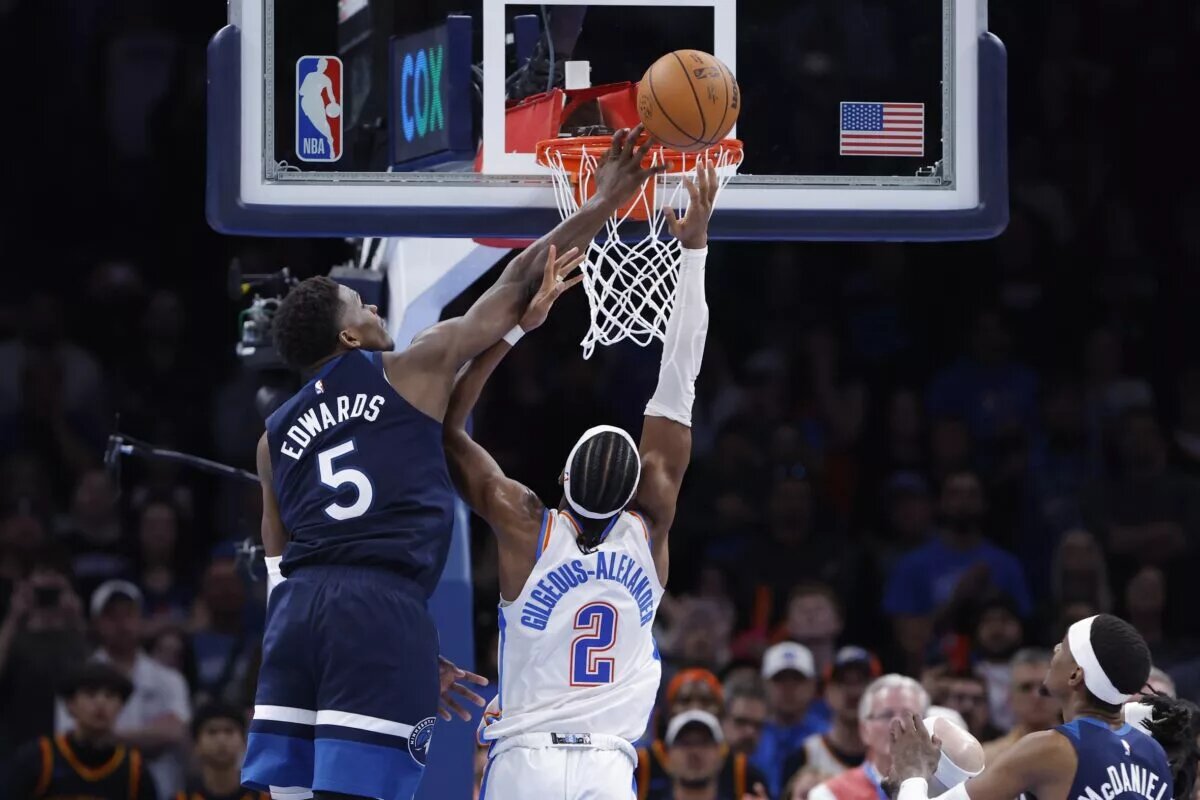 Feb 24, 2025; Oklahoma City, Oklahoma, USA; Minnesota Timberwolves guard Anthony Edwards (5) blocks a shot by Oklahoma City Thunder guard Shai Gilgeous-Alexander (2) during the second half at Paycom Center. Mandatory Credit: Alonzo Adams-Imagn Images