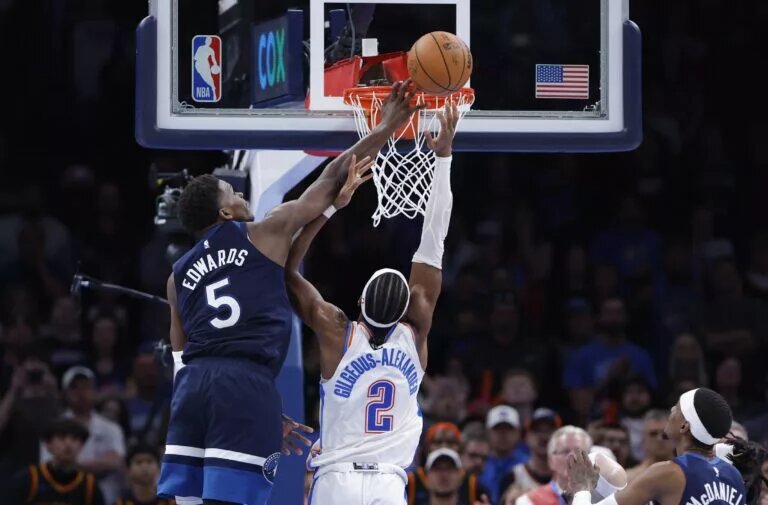 Feb 24, 2025; Oklahoma City, Oklahoma, USA; Minnesota Timberwolves guard Anthony Edwards (5) blocks a shot by Oklahoma City Thunder guard Shai Gilgeous-Alexander (2) during the second half at Paycom Center. Mandatory Credit: Alonzo Adams-Imagn Images