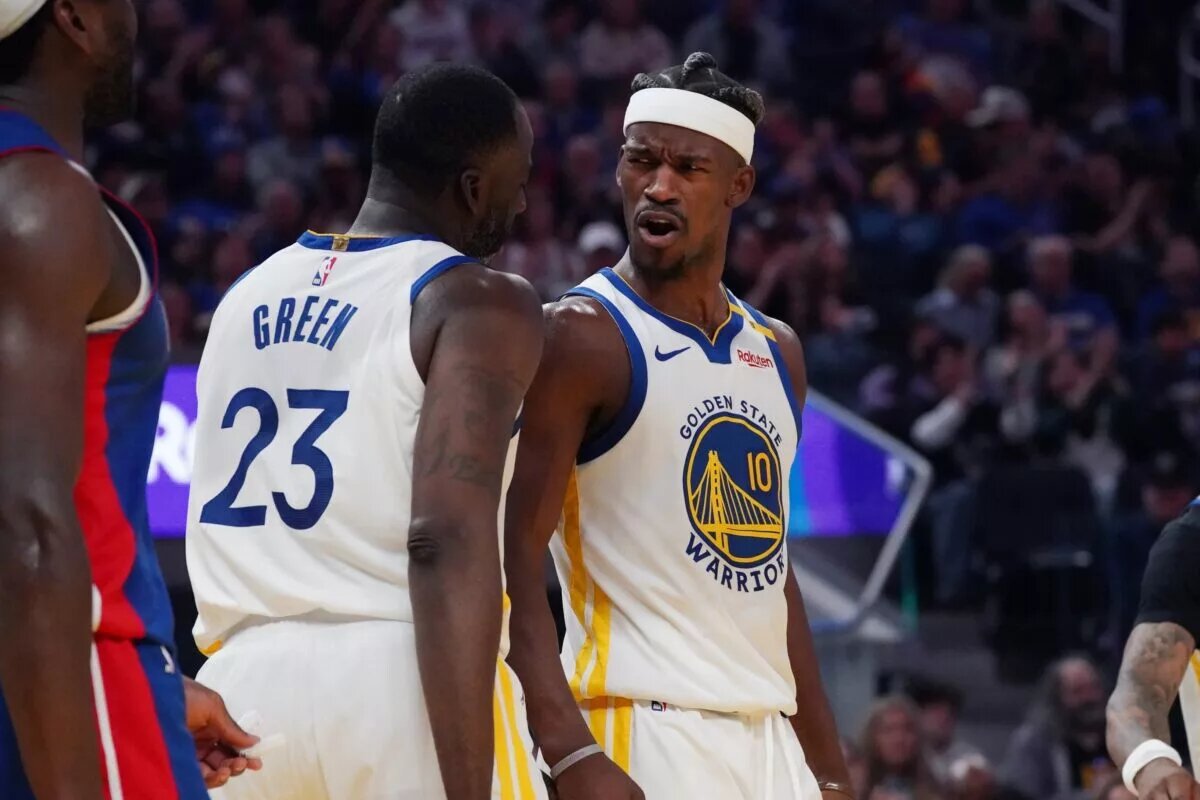 Golden State Warriors forward Jimmy Butler III (10) celebrates with forward Draymond Green