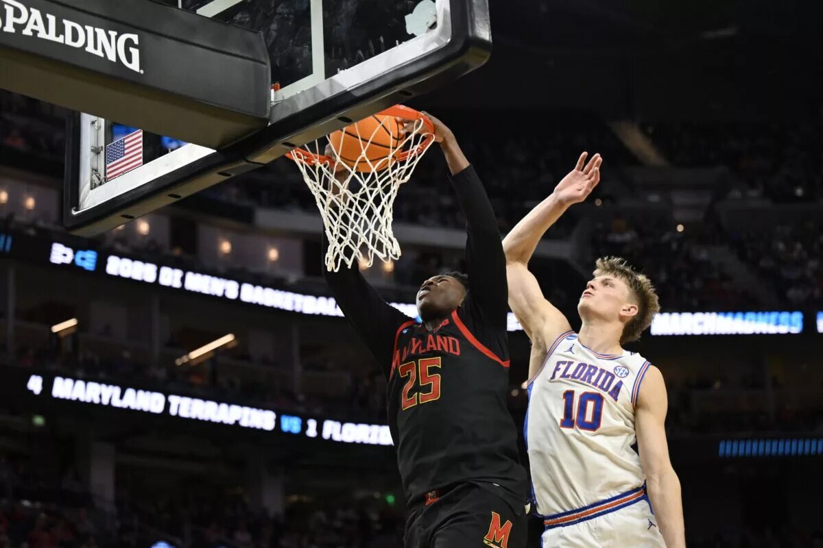Mar 27, 2025; San Francisco, CA, USA; Maryland Terrapins center Derik Queen (25) dunks past Florida Gators forward Thomas Haugh (10) during the second half during a West Regional semifinal of the 2025 NCAA tournament at Chase Center. Mandatory Credit: Eakin Howard-Imagn Images