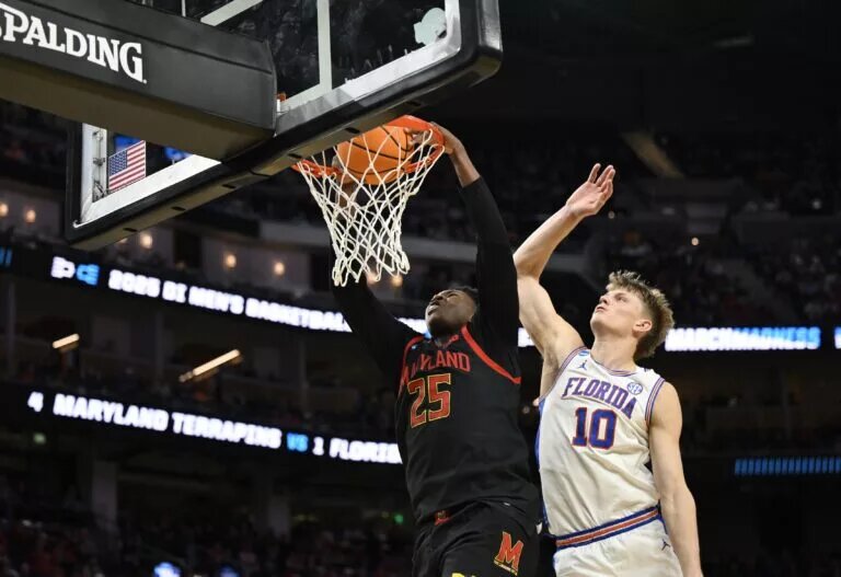 Mar 27, 2025; San Francisco, CA, USA; Maryland Terrapins center Derik Queen (25) dunks past Florida Gators forward Thomas Haugh (10) during the second half during a West Regional semifinal of the 2025 NCAA tournament at Chase Center. Mandatory Credit: Eakin Howard-Imagn Images