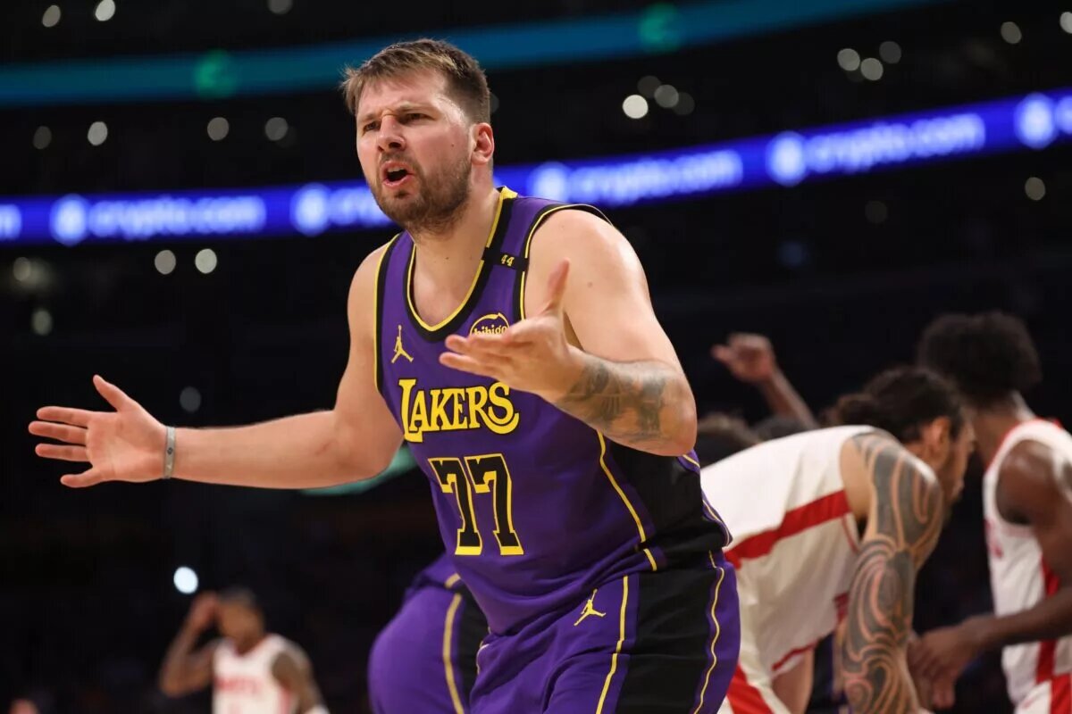 Mar 31, 2025; Los Angeles, California, USA; Los Angeles Lakers guard Luka Doncic (77) reacts to a play during the third quarter against the Houston Rockets at Crypto.com Arena. Mandatory Credit: Kiyoshi Mio-Imagn Images
