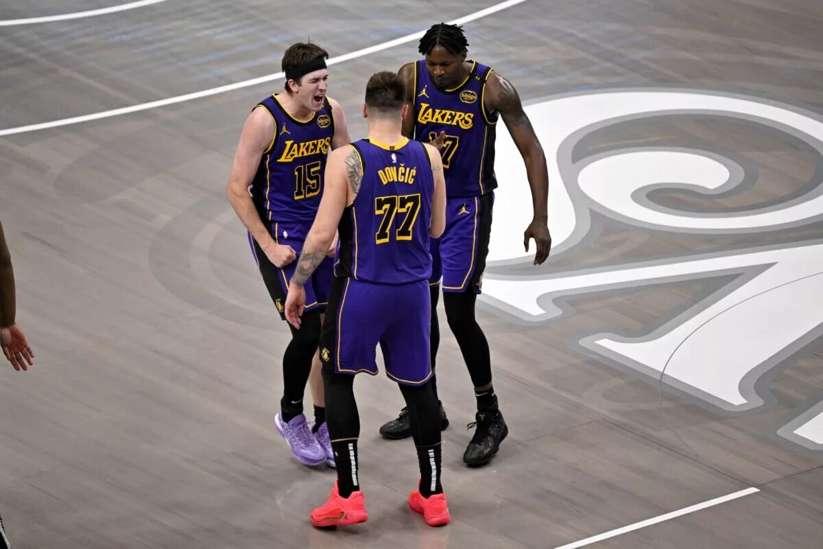 Apr 9, 2025; Dallas, Texas, USA; Los Angeles Lakers guard Luka Doncic (77) and guard Austin Reaves (15) and forward Dorian Finney-Smith (17) celebrate during the fourth quarter against the Dallas Mavericks at the American Airlines Center. Mandatory Credit: Jerome Miron-Imagn Images