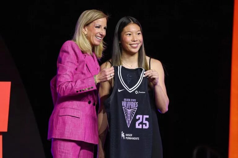 Apr 14, 2025; New York, New York, USA; Kaitlyn Chen poses with WNBA commissioner Cathy Engelbert after being selected with the number thirty overall pick to the Golden State Valkyries in the 2025 WNBA Draft at The Shed at Hudson Yards. Mandatory Credit: Vincent Carchietta-Imagn Images