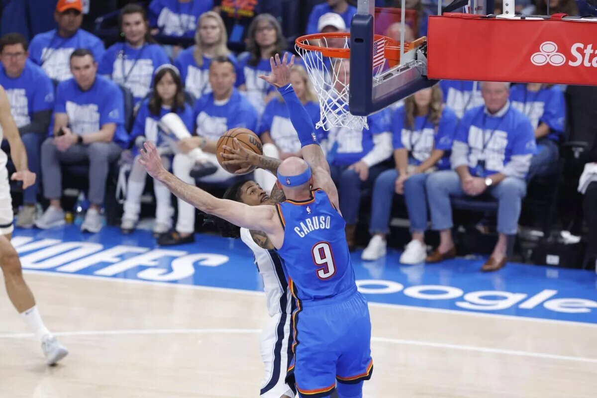 Oklahoma City Thunder guard Alex Caruso (9) defends a shot by Memphis Grizzlies guard Ja Morant (12) in the second quarter during game two of first round for the 2024 NBA Playoffs at Paycom Center.