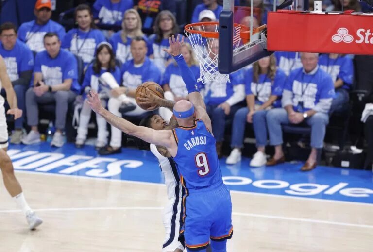 Oklahoma City Thunder guard Alex Caruso (9) defends a shot by Memphis Grizzlies guard Ja Morant (12) in the second quarter during game two of first round for the 2024 NBA Playoffs at Paycom Center.