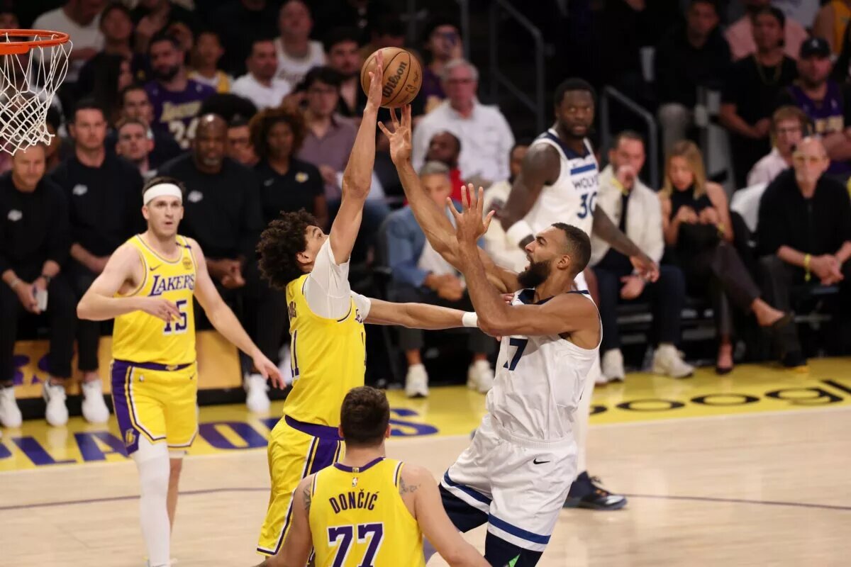 Apr 22, 2025; Los Angeles, California, USA; Minnesota Timberwolves center Rudy Gobert (27) shoots the ball against Los Angeles Lakers center Jaxson Hayes (11) during the first quarter of game two of first round for the 2024 NBA Playoffs at Crypto.com Arena. Mandatory Credit: Kiyoshi Mio-Imagn Images