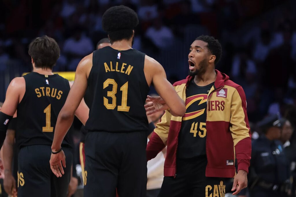 Cleveland Cavaliers guard Donovan Mitchell (45) celebrates with center Jarrett Allen 