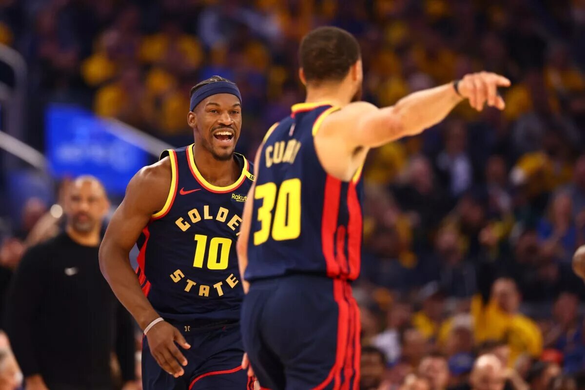 Golden State Warriors forward Jimmy Butler III (10) celebrates towards guard Stephen Curry