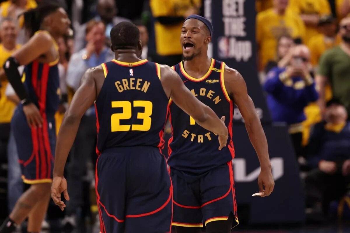 Golden State Warriors forward Draymond Green (23) celebrates with forward Jimmy Butler III