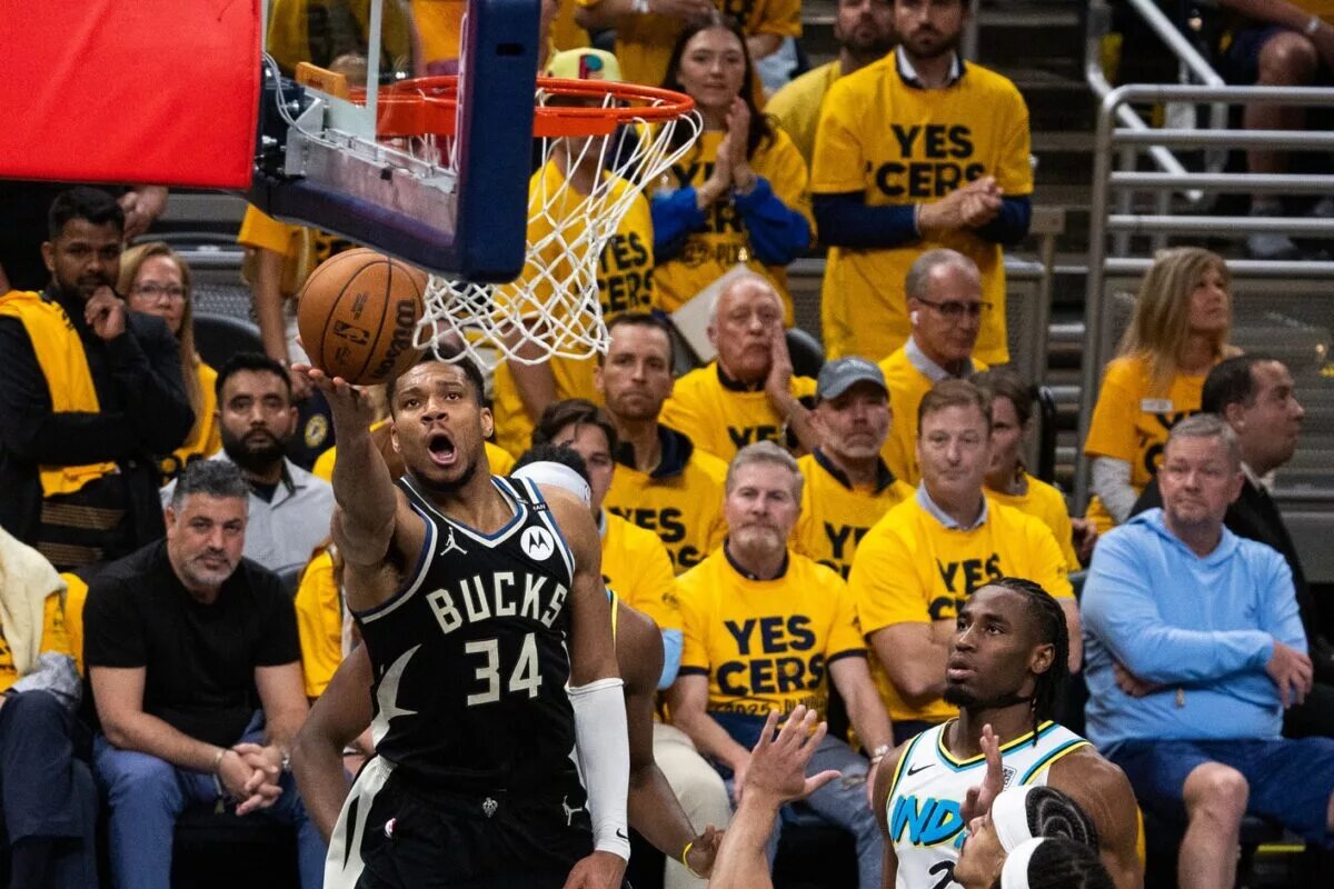 Apr 29, 2025; Indianapolis, Indiana, USA; Milwaukee Bucks forward Giannis Antetokounmpo (34) shoots the ball while Indiana Pacers guard Andrew Nembhard (2) defends during game five of the first round for the 2024 NBA Playoffs at Gainbridge Fieldhouse. Mandatory Credit: Trevor Ruszkowski-Imagn Images