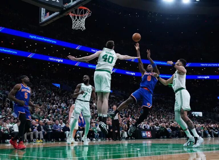 New York Knicks forward OG Anunoby (8) shoots the ball against Boston Celtics center Luke Kornet (40) in the third quarter during game one of the second round for the 2025 NBA Playoffs at TD Garden.