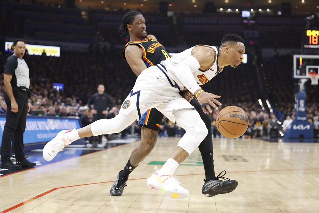 Denver Nuggets guard Russell Westbrook (4) drives against Oklahoma City Thunder forward Jalen Williams 