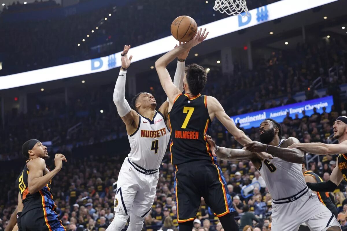 May 7, 2025; Oklahoma City, Oklahoma, USA; Oklahoma City Thunder forward Chet Holmgren (7) defends a shot by Denver Nuggets guard Russell Westbrook (4) in the second quarter during game two of the second round for the 2025 NBA Playoffs at Paycom Center. Mandatory Credit: Alonzo Adams-Imagn Images