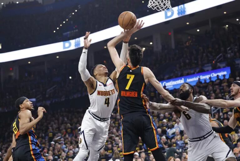 May 7, 2025; Oklahoma City, Oklahoma, USA; Oklahoma City Thunder forward Chet Holmgren (7) defends a shot by Denver Nuggets guard Russell Westbrook (4) in the second quarter during game two of the second round for the 2025 NBA Playoffs at Paycom Center. Mandatory Credit: Alonzo Adams-Imagn Images