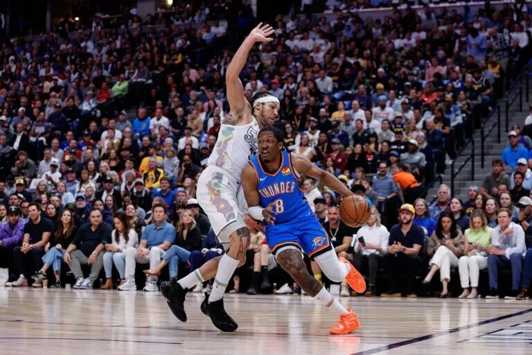 May 15, 2025; Denver, Colorado, USA; Oklahoma City Thunder forward Jalen Williams (8) controls the ball under pressure from Denver Nuggets forward Aaron Gordon (32) in the first quarter during game six of the second round for the 2025 NBA Playoffs at Ball Arena. Mandatory Credit: Isaiah J. Downing-Imagn Images