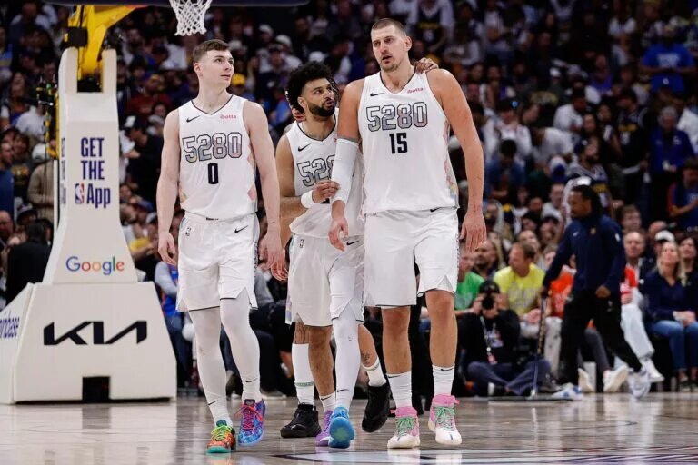 Denver Nuggets guard Jamal Murray (27) and center Nikola Jokic (15) and guard Christian Braun