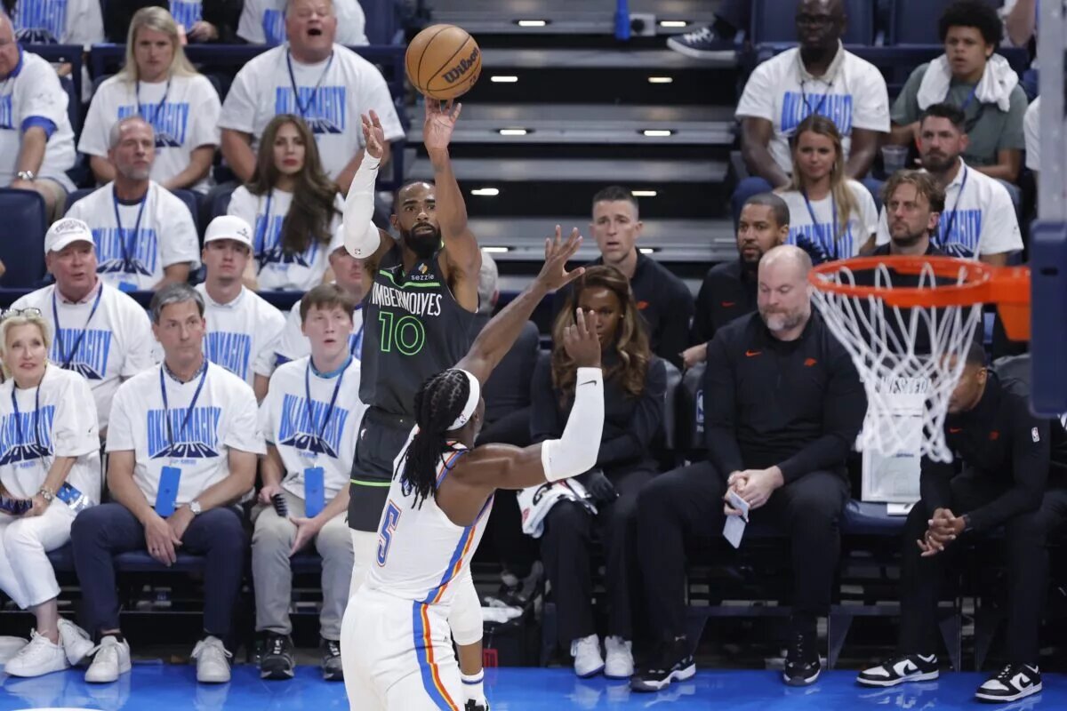 May 20, 2025; Oklahoma City, Oklahoma, USA; Minnesota Timberwolves guard Mike Conley (10) shoots against Oklahoma City Thunder guard Luguentz Dort (5) in the third quarter during game one of the western conference finals for the 2025 NBA Playoffs at Paycom Center. Mandatory Credit: Alonzo Adams-Imagn Images