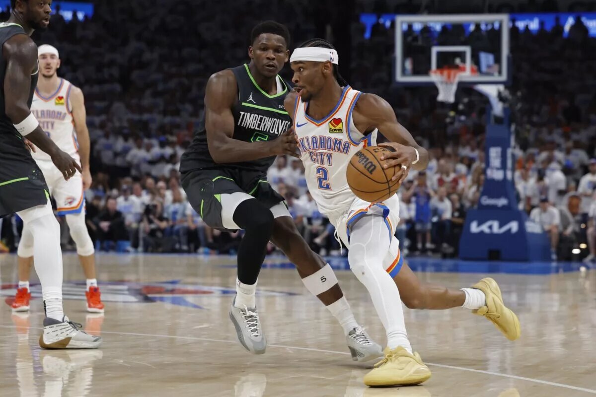 May 20, 2025; Oklahoma City, Oklahoma, USA; Oklahoma City Thunder guard Shai Gilgeous-Alexander (2) drives against Minnesota Timberwolves guard Anthony Edwards (5) in the fourth quarter during game one of the western conference finals for the 2025 NBA Playoffs at Paycom Center. Mandatory Credit: Alonzo Adams-Imagn Images