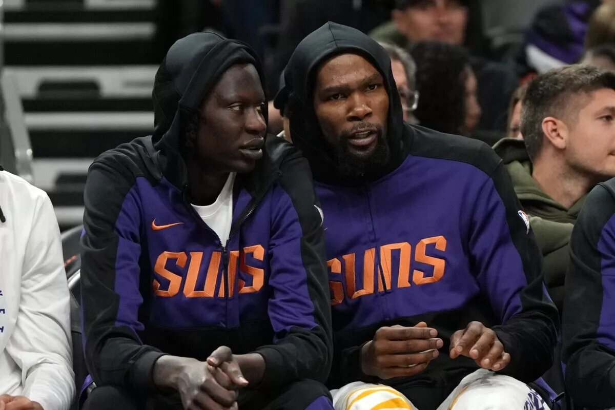Phoenix Suns center Bol Bol (11) and forward Kevin Durant (35) watch from the bench against the Toronto Raptors