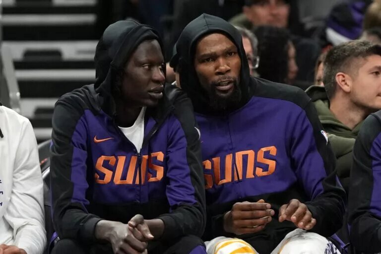 Phoenix Suns center Bol Bol (11) and forward Kevin Durant (35) watch from the bench against the Toronto Raptors