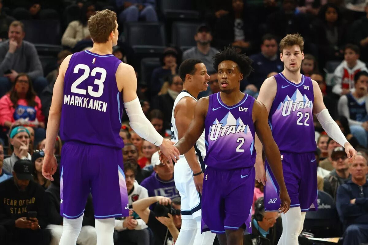 Utah Jazz guard Collin Sexton (2) reacts with forward Lauri Markkanen (23) during the second quarter
