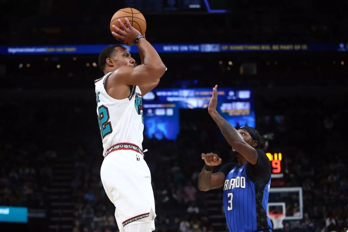Memphis Grizzlies guard Desmond Bane (22) shoots as Orlando Magic guard Kentavious Caldwell-Pope (3) defends