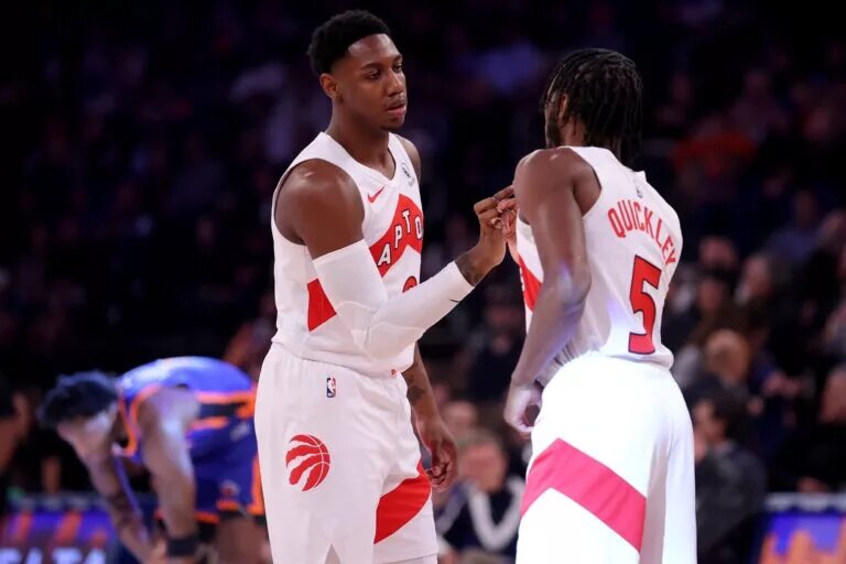 Toronto Raptors trade acquisitions RJ Barrett (9) and Immanuel Quickley (5) fist bump