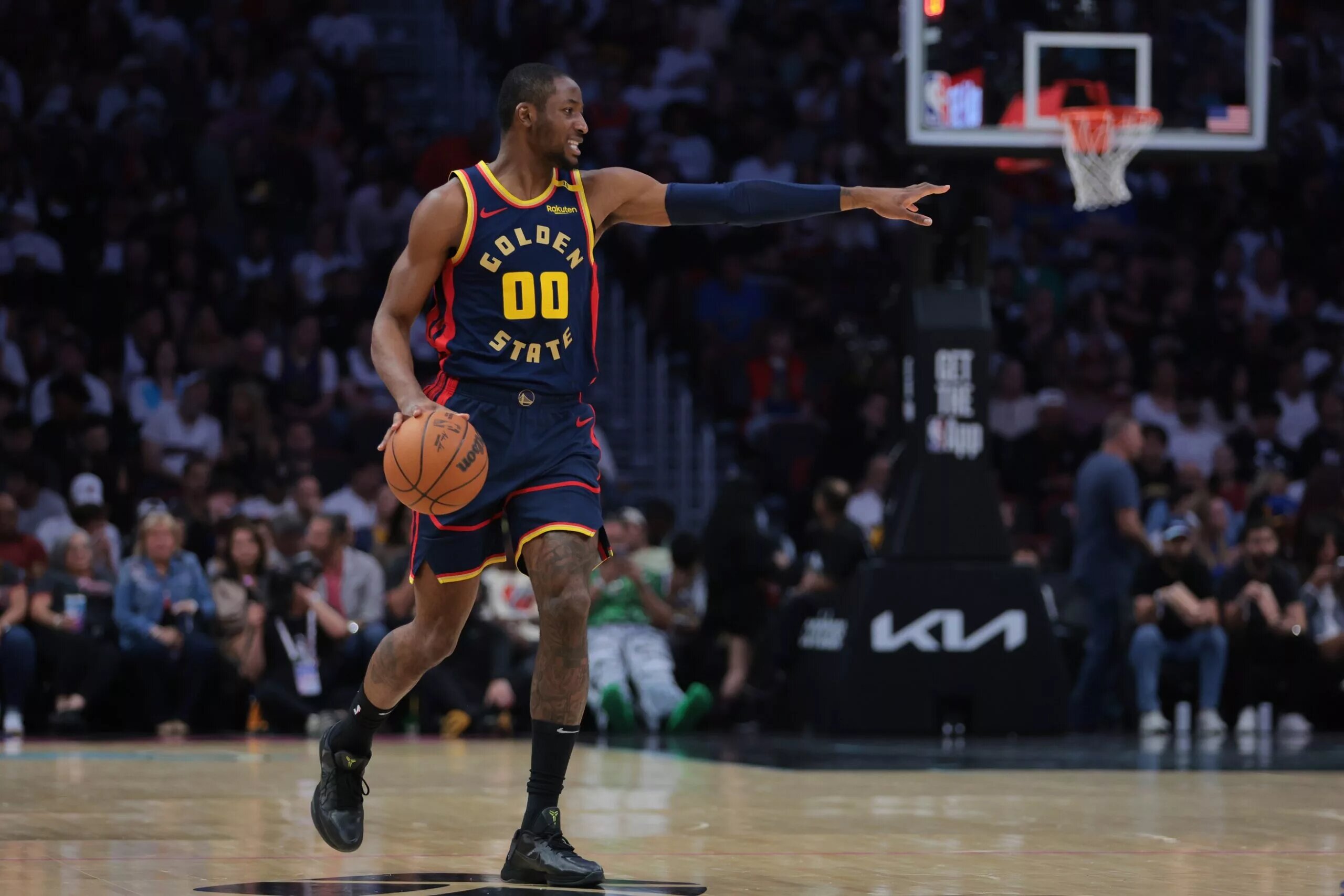 Golden State Warriors sign and trade candidate Jonathan Kuminga signaling against the Miami Heat