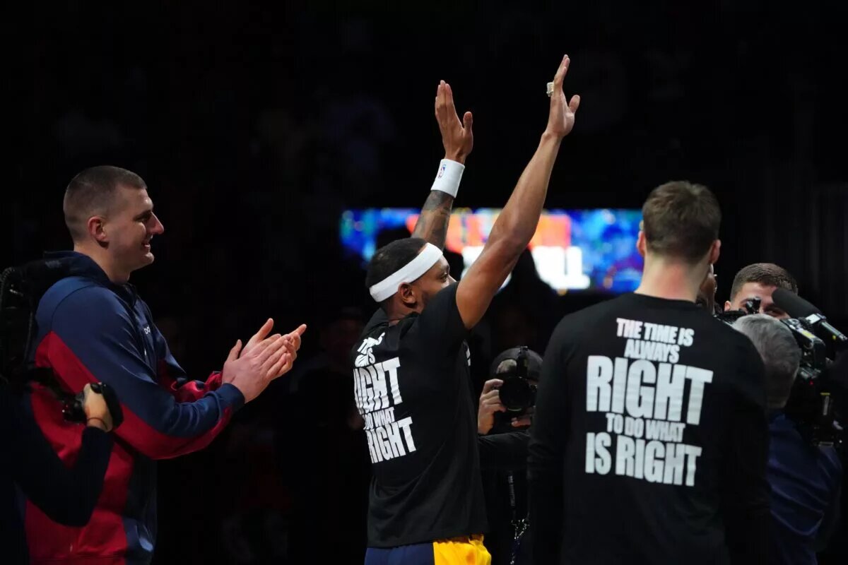 Bruce Brown Jr. waves to the Denver Nuggets crowd