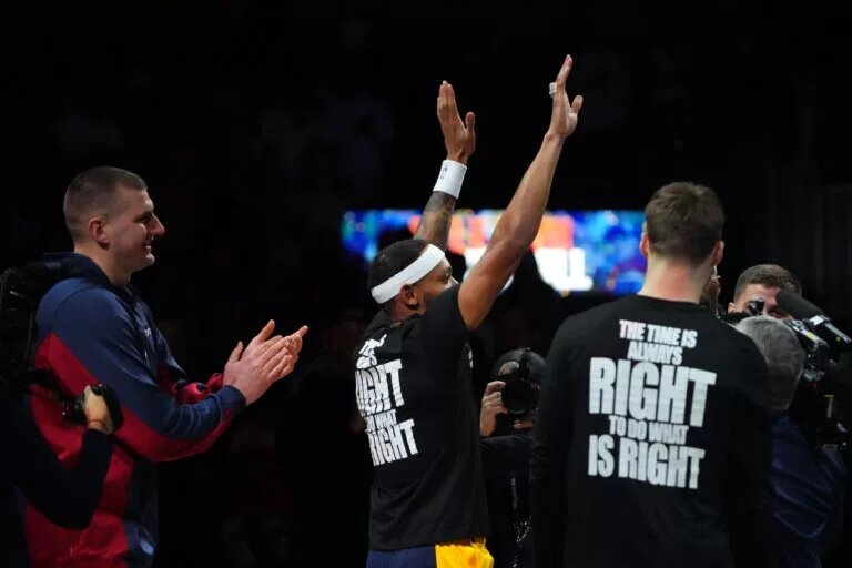 Bruce Brown Jr. waves to the Denver Nuggets crowd