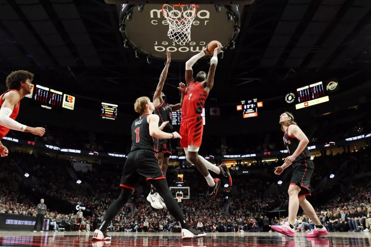 Mar 9, 2024; Portland, Oregon, USA; Portland Trail Blazers center Deandre Ayton (2) goes up for a dunk against Toronto Raptors shooting guard Immanuel Quickly (5) during the second half at Moda Center. Mandatory Credit: Soobum Im-USA TODAY Sports