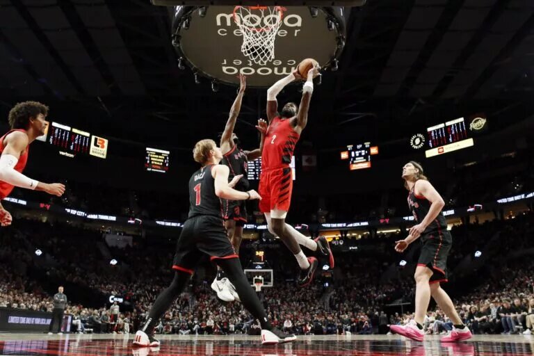 Mar 9, 2024; Portland, Oregon, USA; Portland Trail Blazers center Deandre Ayton (2) goes up for a dunk against Toronto Raptors shooting guard Immanuel Quickly (5) during the second half at Moda Center. Mandatory Credit: Soobum Im-USA TODAY Sports