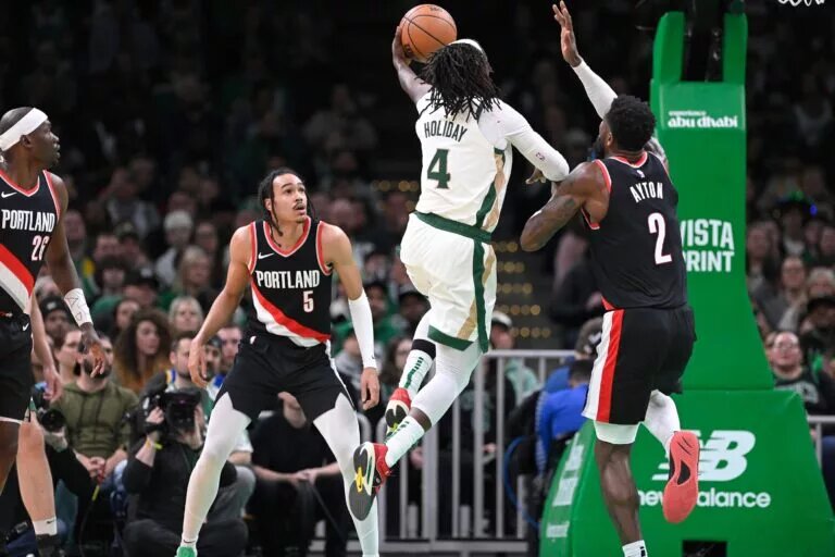 Jrue Holiday has been traded by the Celtics to the Trail Blazers for Anfernee Simons