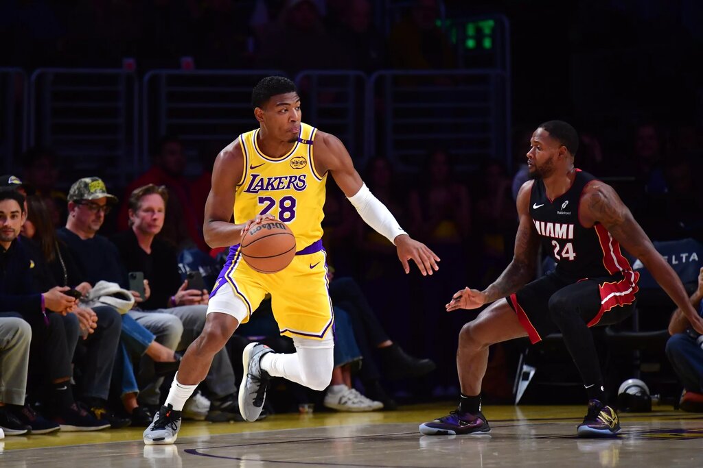 Jan 15, 2025; Los Angeles, California, USA; Los Angeles Lakers forward Rui Hachimura (28) moves the ball against Miami Heat forward Haywood Highsmith (24) during the first half at Crypto.com Arena. Mandatory Credit: Gary A. Vasquez-Imagn Images