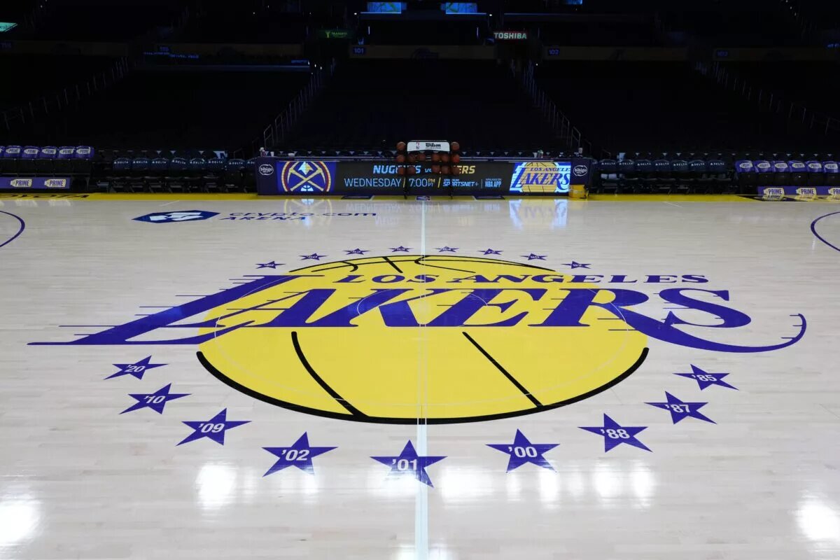 Mar 17, 2025; Los Angeles, California, USA; The Los Angeles Lakers logo at midcourt at Crypto.com Arena. Mandatory Credit: Kirby Lee-Imagn Images