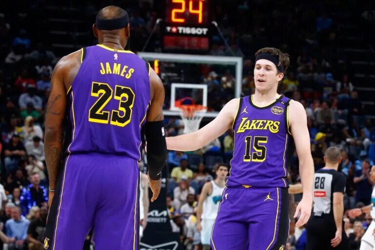 Mar 29, 2025; Memphis, Tennessee, USA; Los Angeles Lakers guard Austin Reaves (15) reacts with forward LeBron James (23) during the second quarter against the Memphis Grizzlies at FedExForum. Mandatory Credit: Petre Thomas-Imagn Images