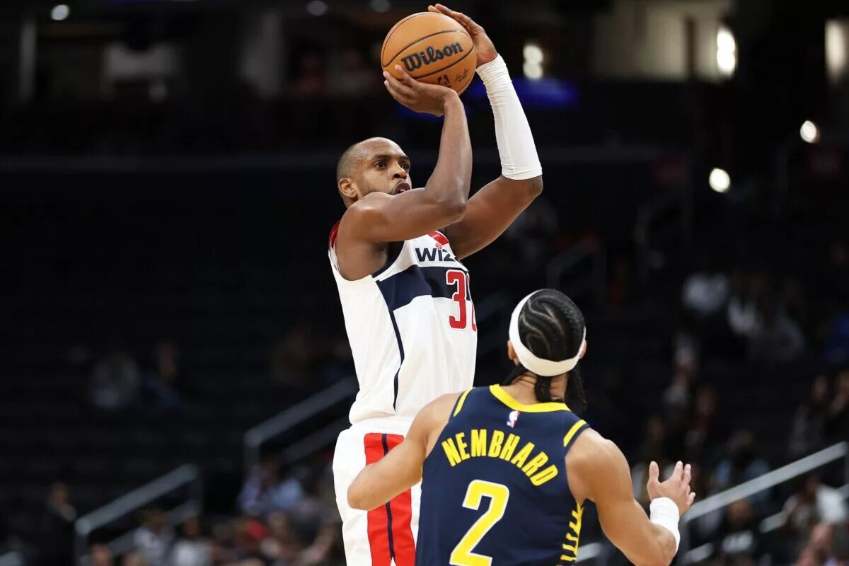 Mar 27, 2025; Washington, District of Columbia, USA; Washington Wizards forward Khris Middleton (32) takes a shot over Indiana Pacers guard Andrew Nembhard (2) during the first half at Capital One Arena. Mandatory Credit: Daniel Kucin Jr.-Imagn Images